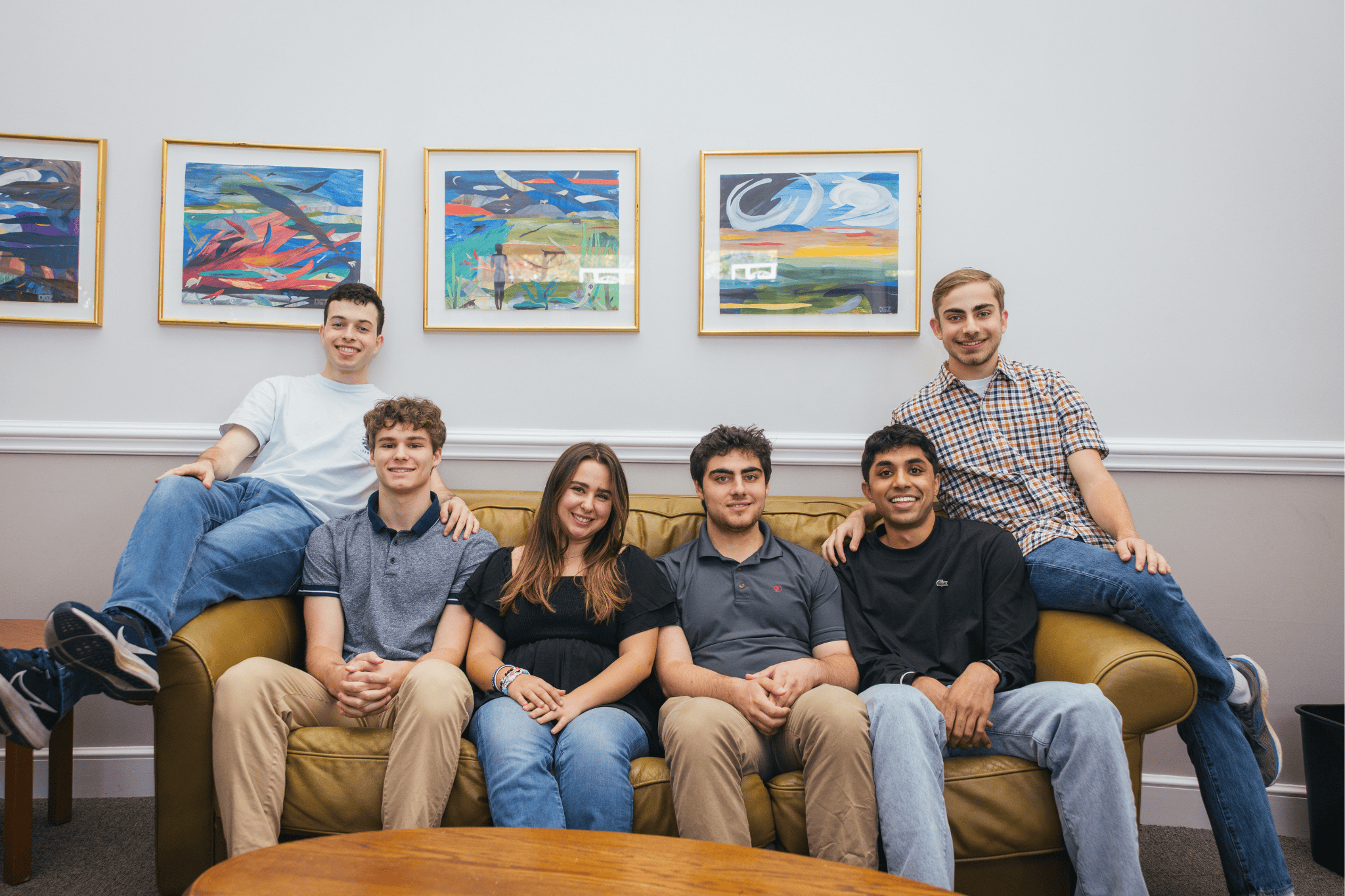 Hillel students sitting on a couch. 