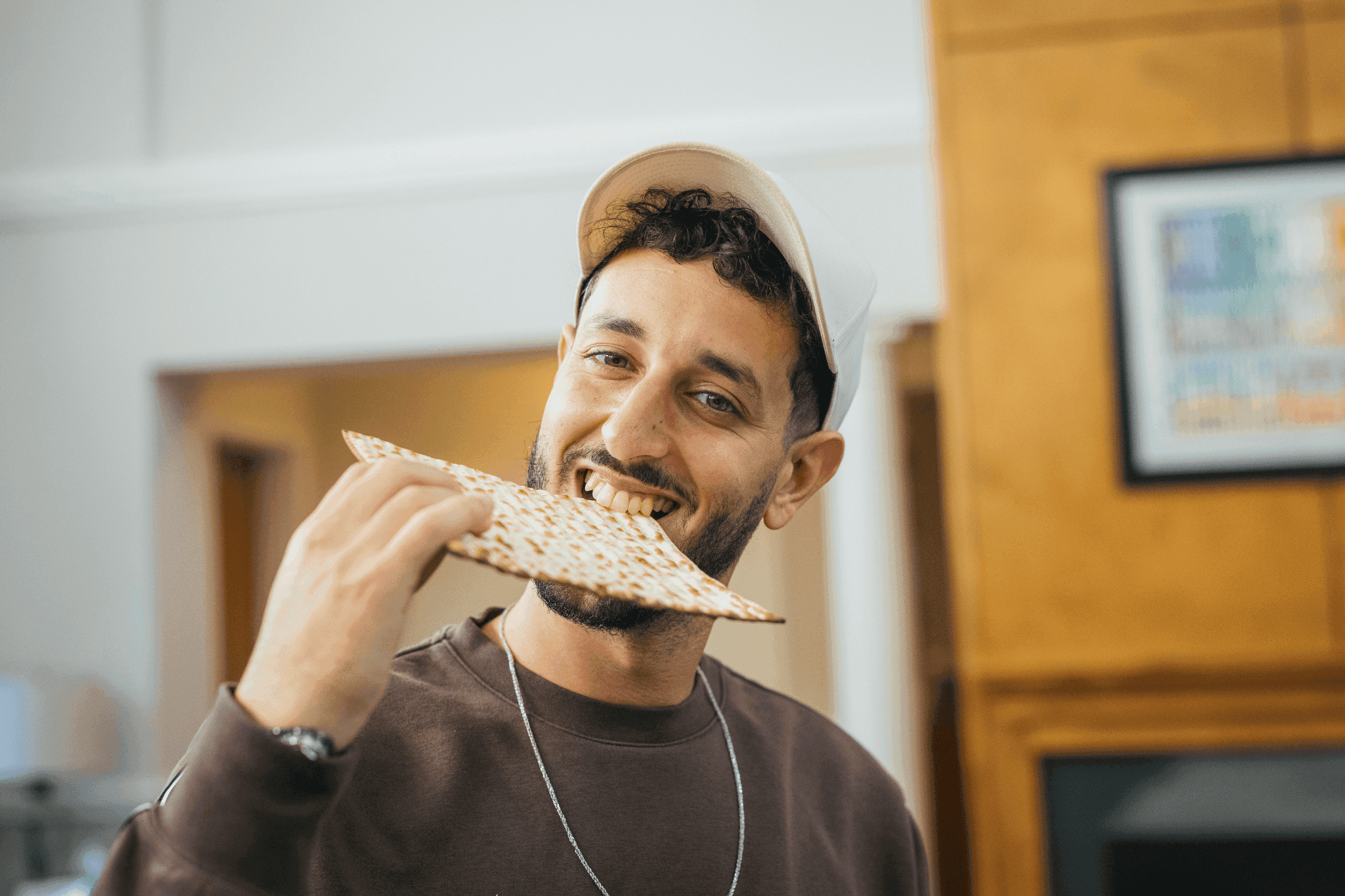 Hillel student eating matzah. 